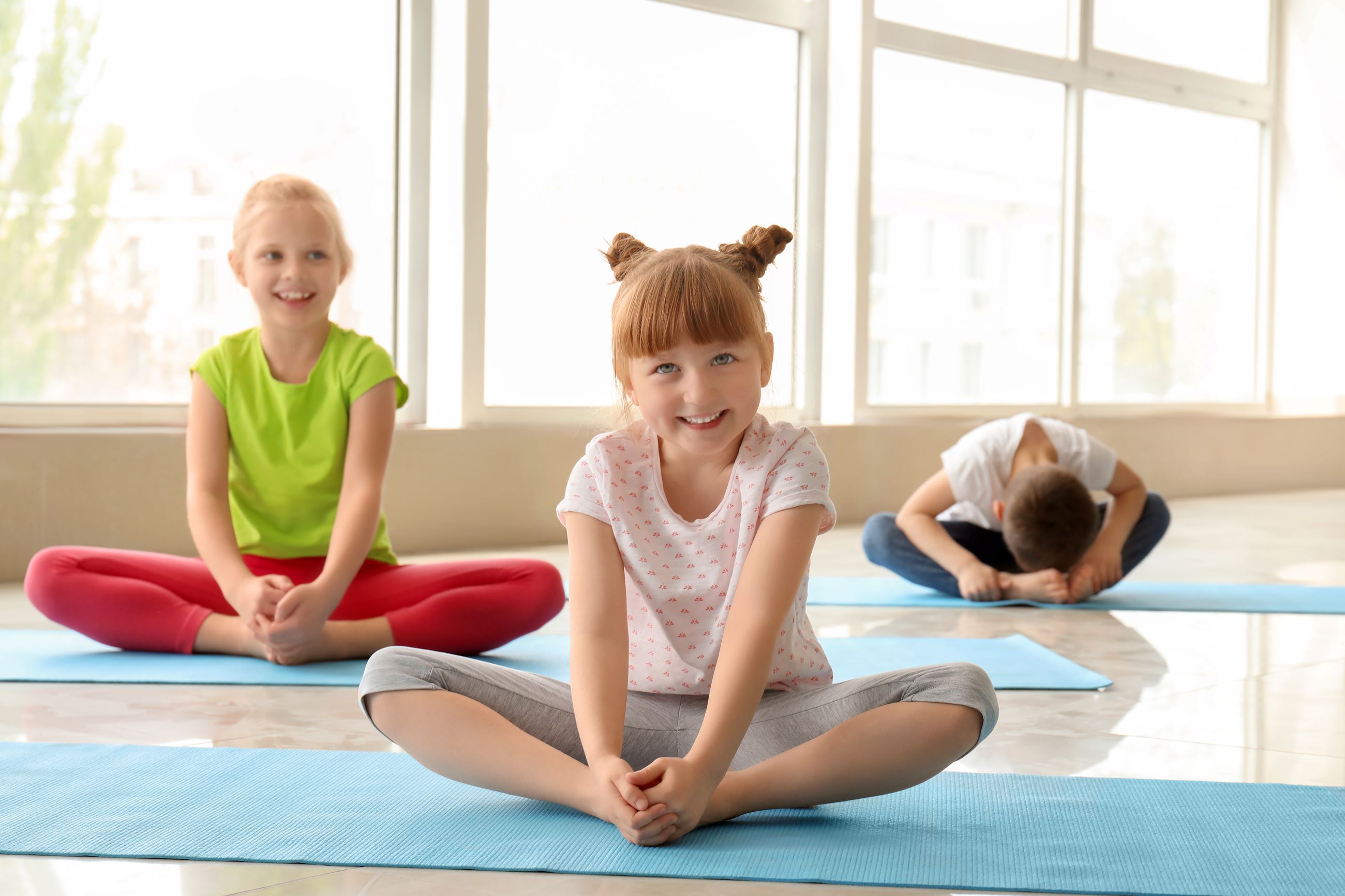 Group of kids in yoga poses